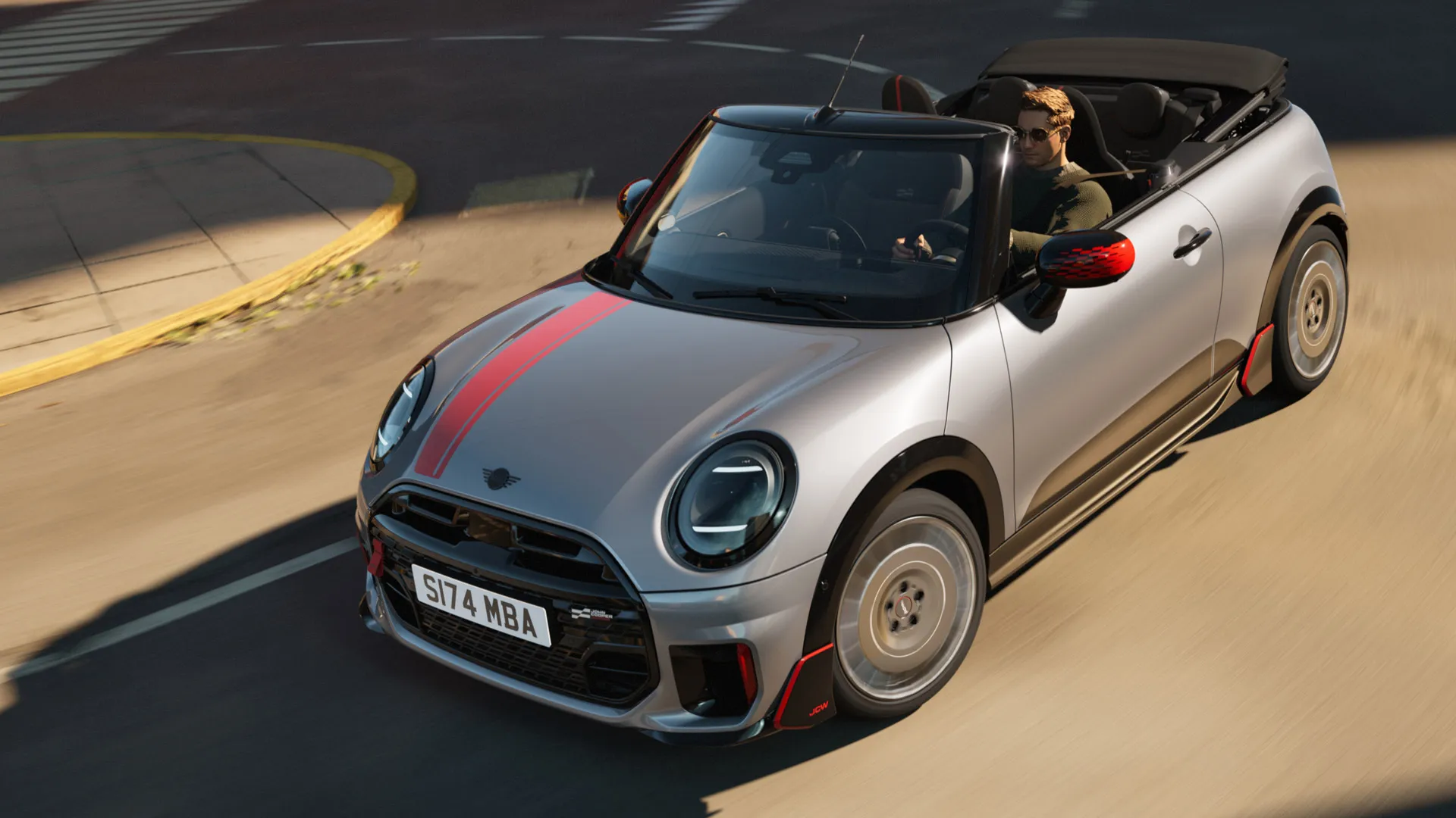 Pogled od zgoraj pod kotom na MINI Cabrio z nalepkami John Cooper Works v barvi Chili Red.