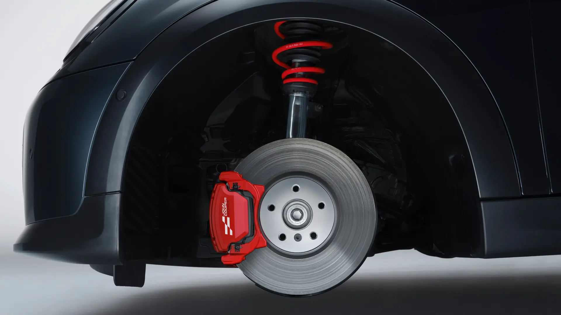 Športno vzmetenje MINI John Cooper Works z vzmetmi v barvi John Cooper Works Chili Red.