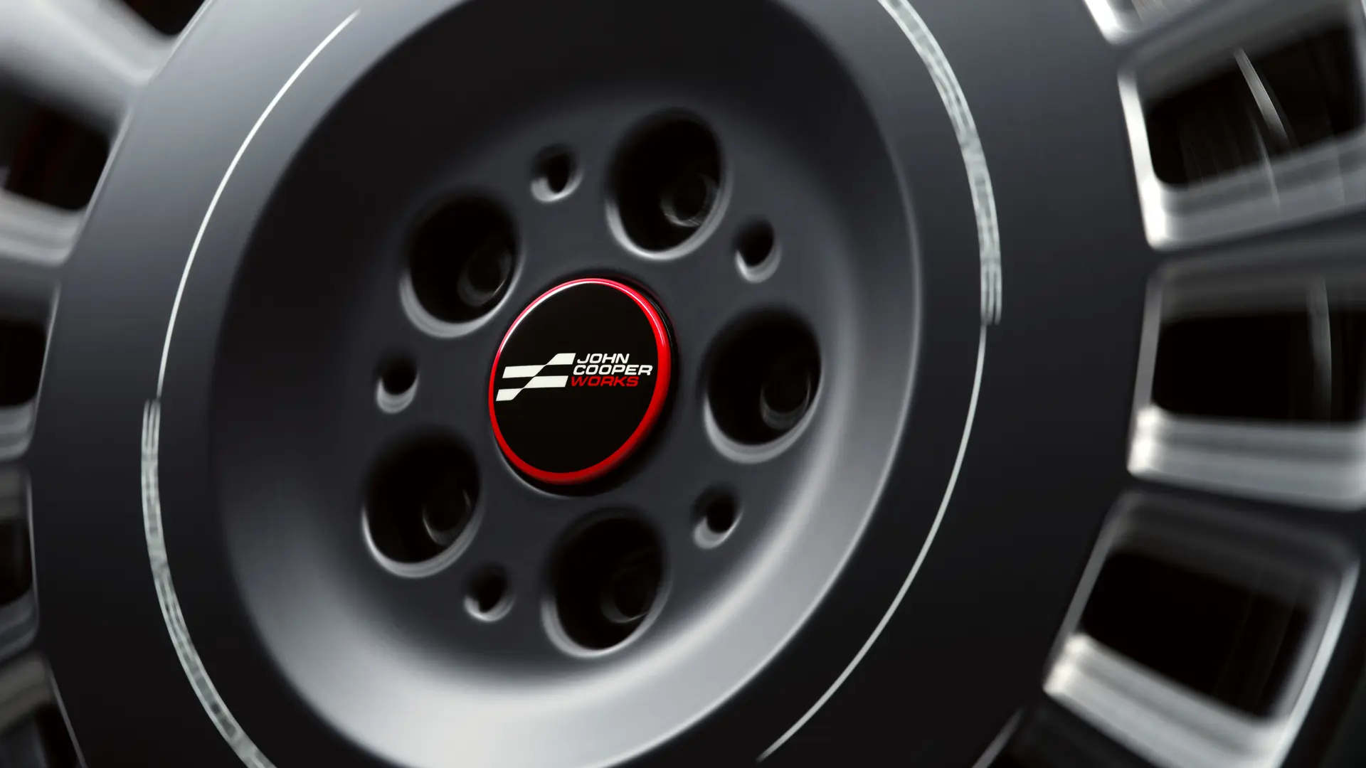 Prosto drseči pokrov platišča John Cooper Works, ki se ne vrti skupaj s kolesom, ampak med vožnjo ostane vodoraven. 