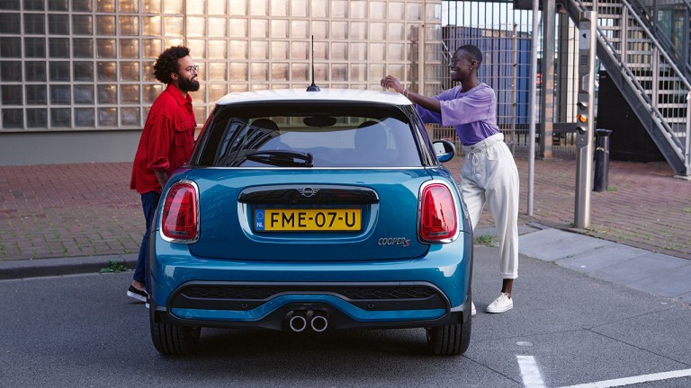 Two people standing next to MINI 3-Door Cooper S